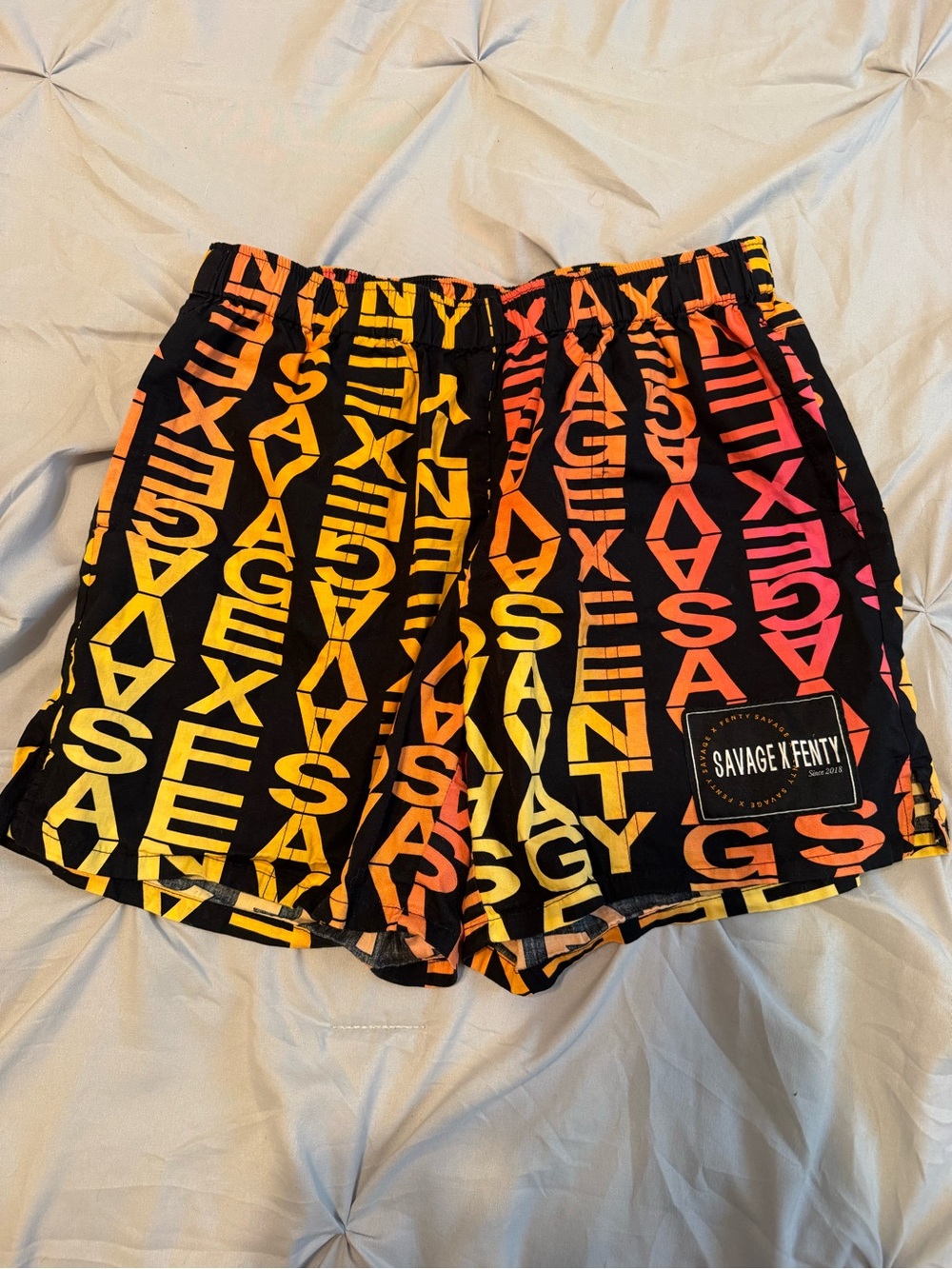 Savage X Fenty Men’s Black Shorts with Orange-to-Pink Gradient Logo